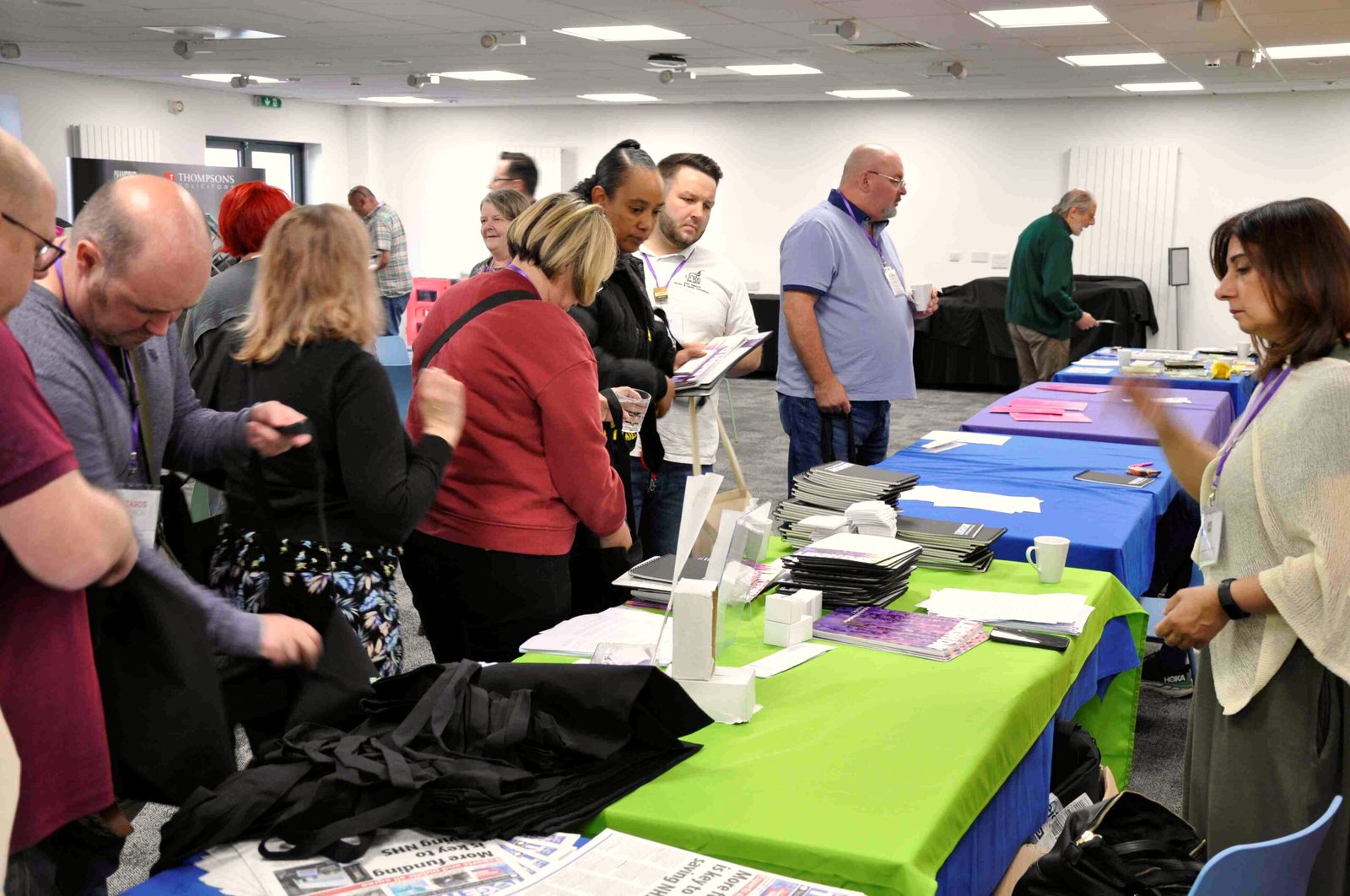 Safety reps looking through leaflets at the conference stalls